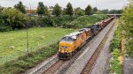 UP 5357 leads WO80 under Mill St. bridge.